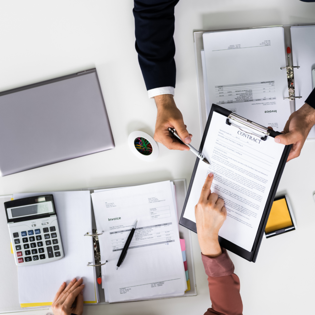 Person reviewing car finance agreement and calculating potential mis-sold charges.