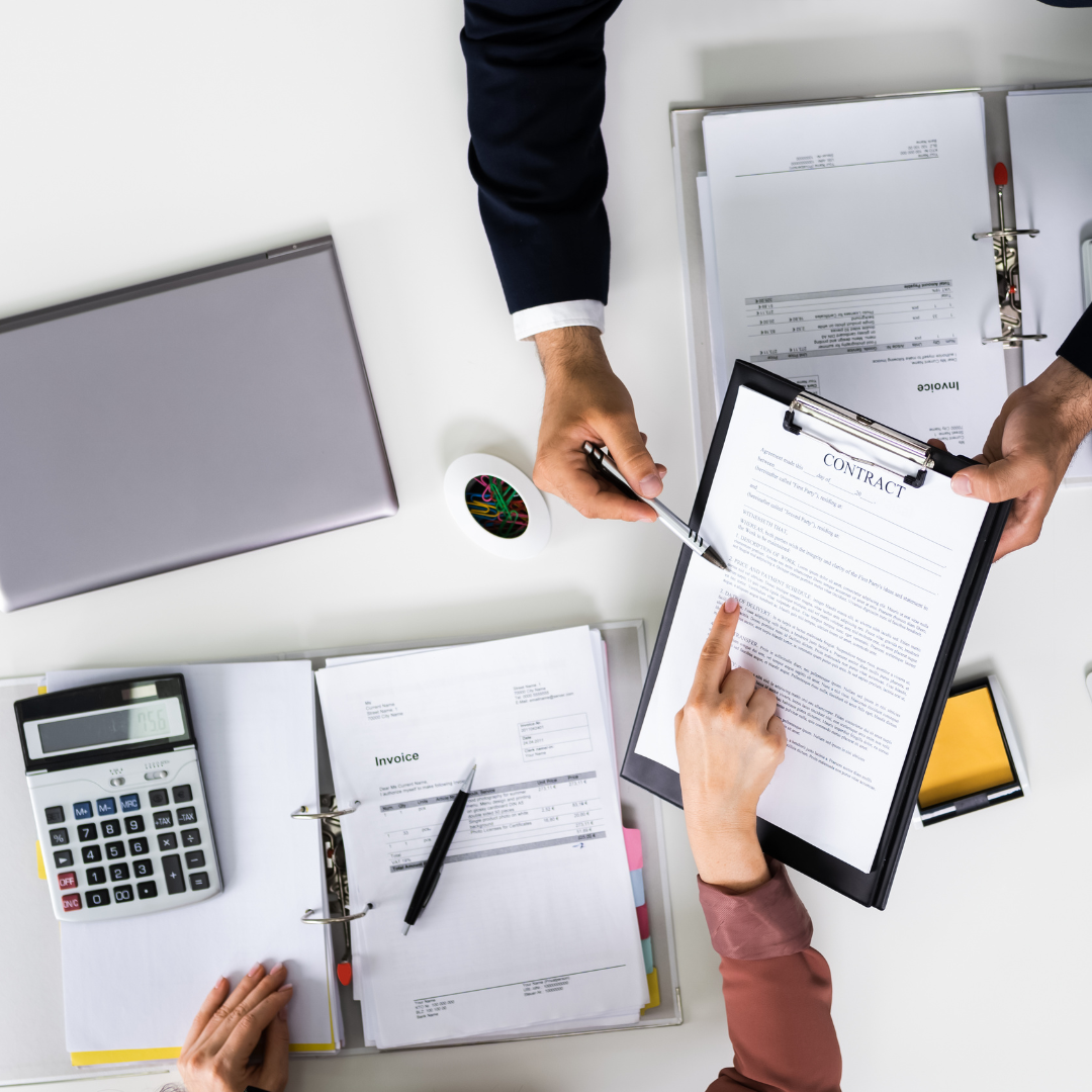 Person reviewing car finance agreement and calculating potential mis-sold charges.